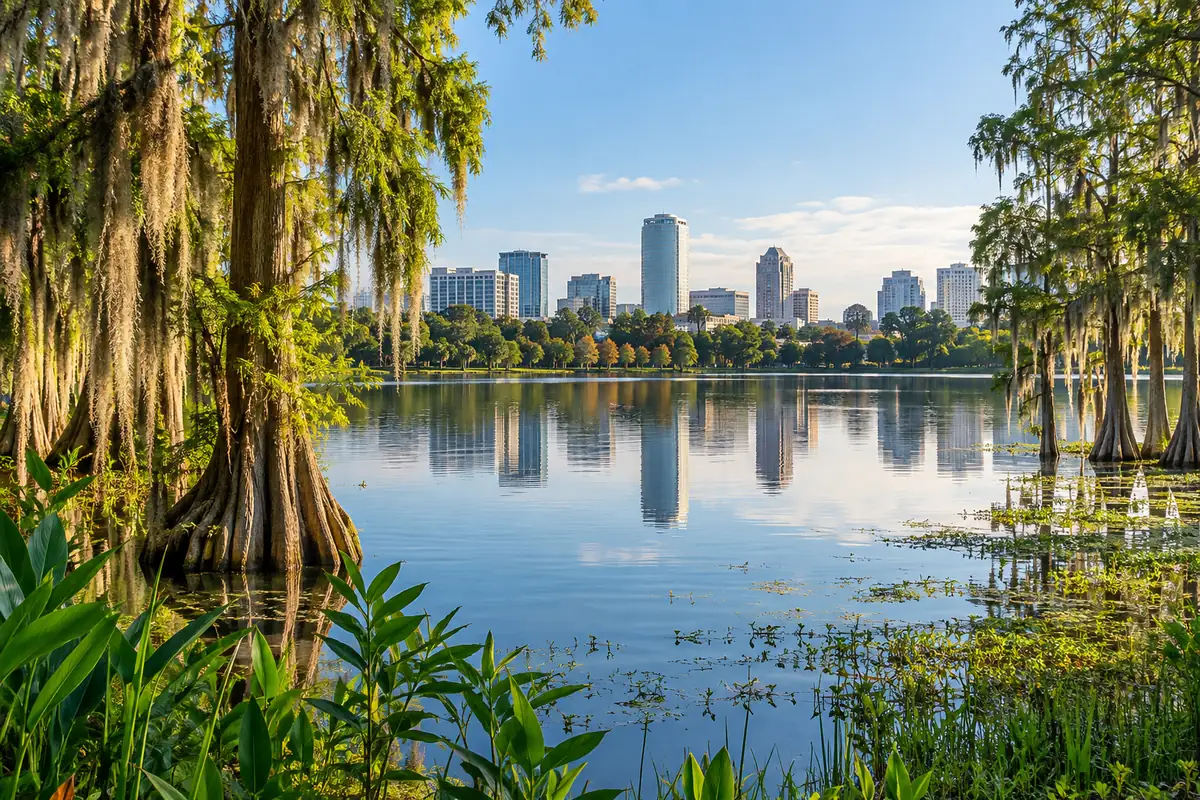 Freshwater lake with cypress trees and the Orlando skyline