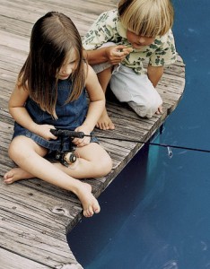 Young Brother and Sister Fishing from Dock